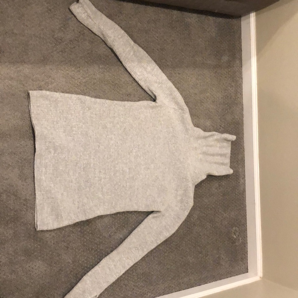 A grey turtle neck